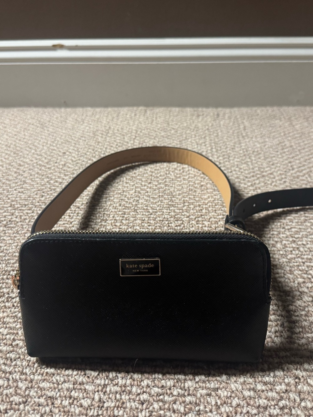Black leather saffiano Kate Spade New York belt bag with gold-tone hardware